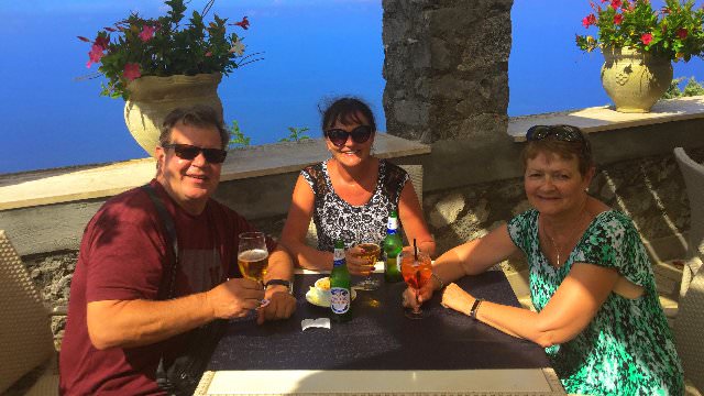 Drinking a cold beer in the warm outdoors with a stunning view of the Amalfi Coast.